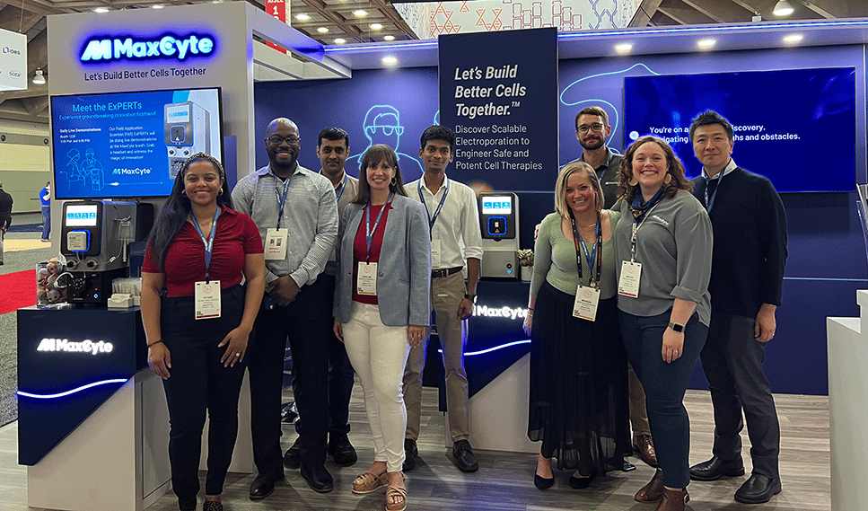 The MaxCyte team standing in front of the MaxCyte booth at the 2024 ASGCT annual meeting